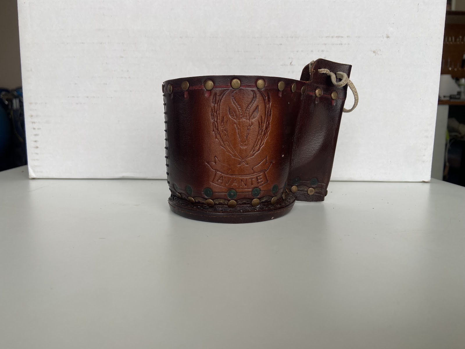 Decorative leather mug wrap with a handle