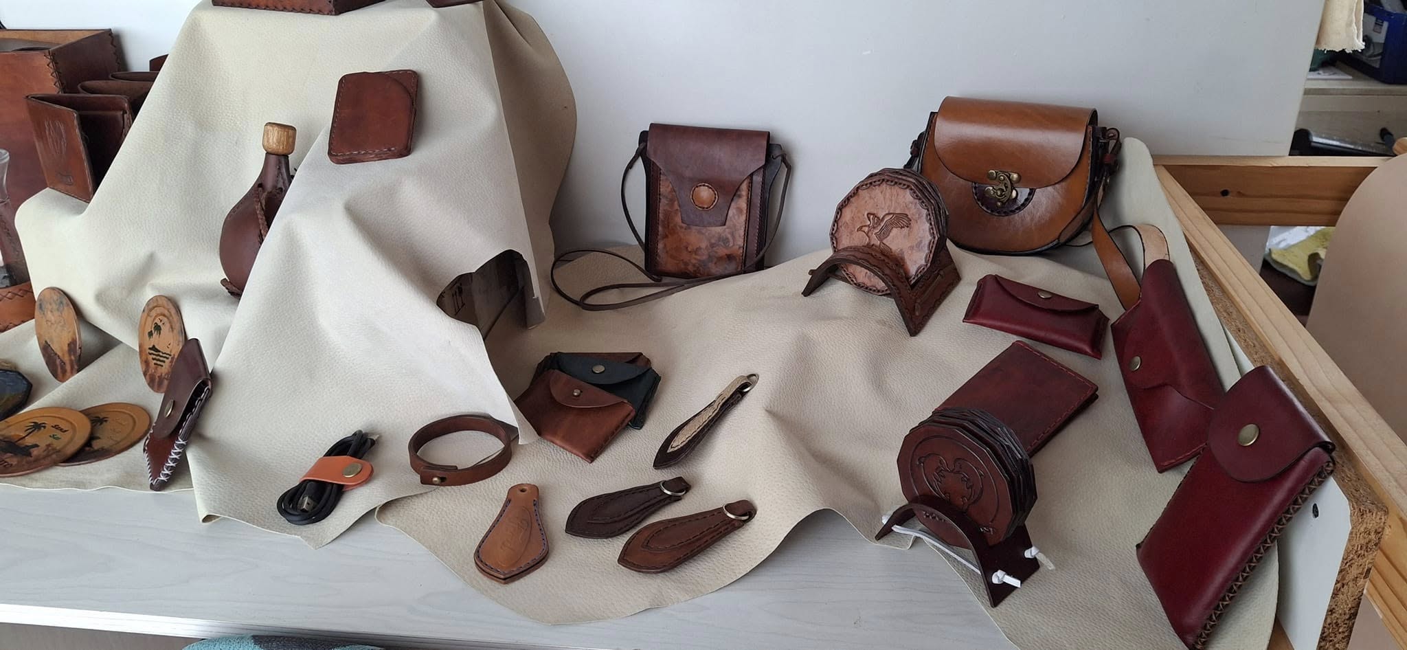 A collection of finished leather pieces laid out together