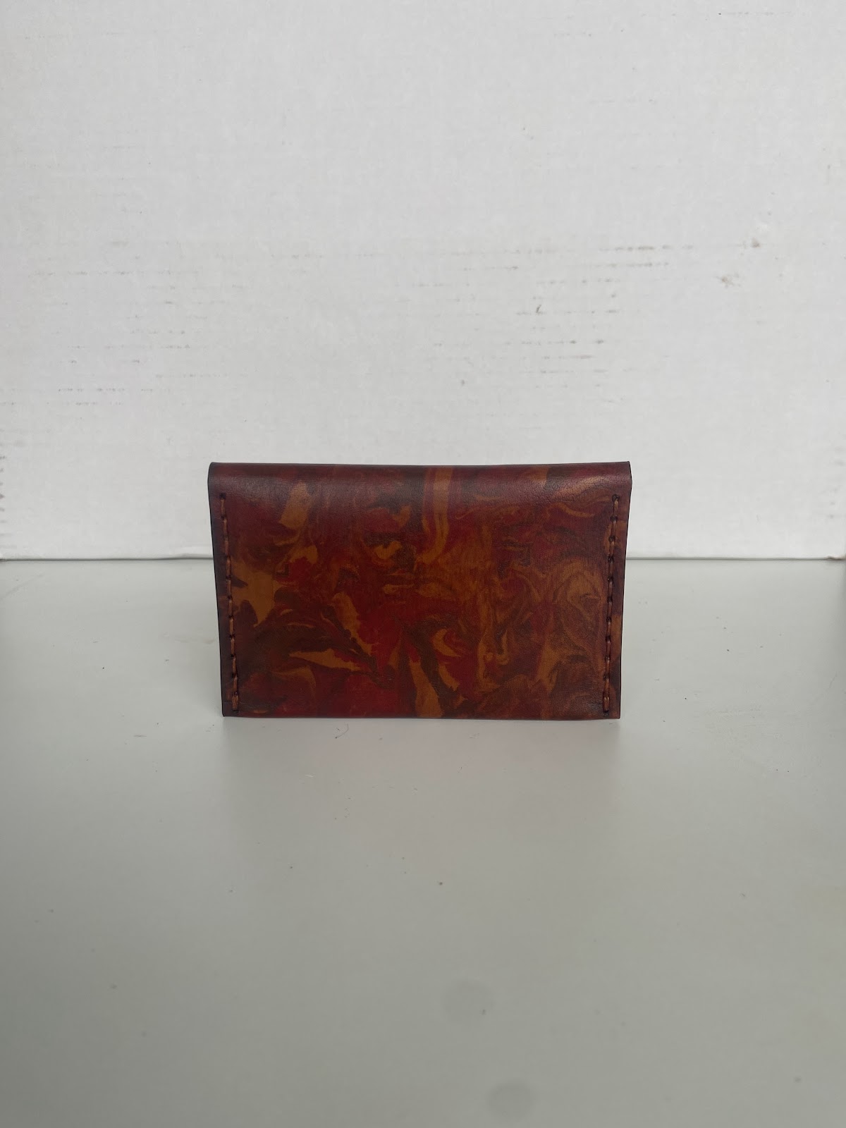 Leather cover with a colourful patterned finish