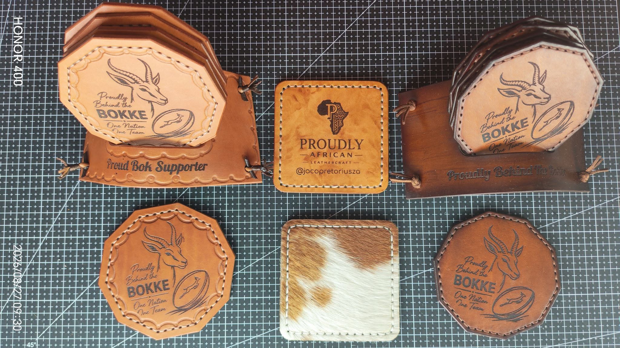Personalised tooled leather coasters and holders with Proudly African emblems