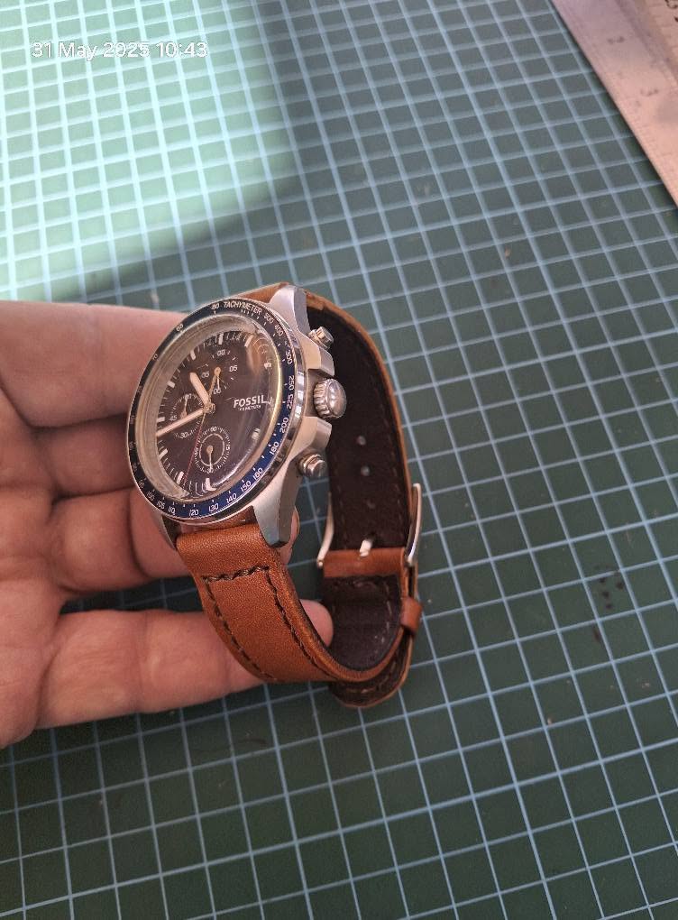Brown leather watch strap on a wristwatch