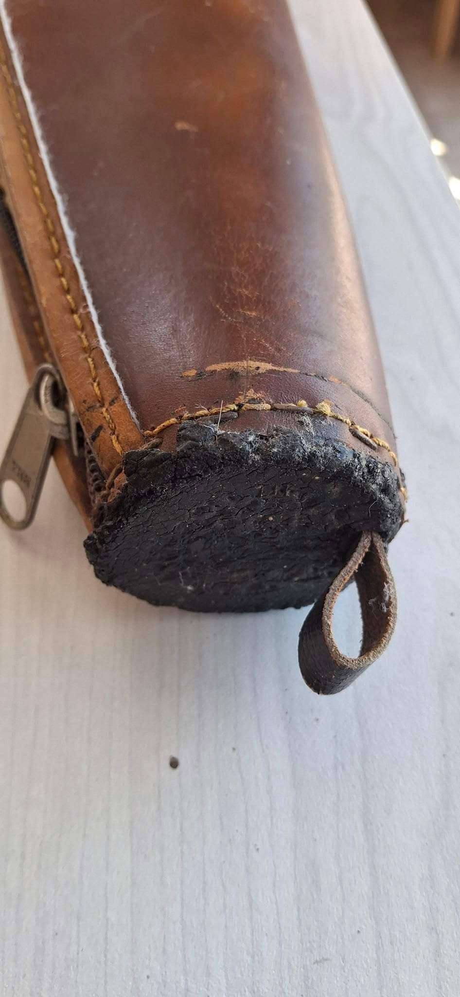 Dark brown leather quiver before restoration
