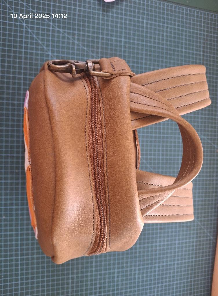 Tan and brown leather zip bag with carry handles