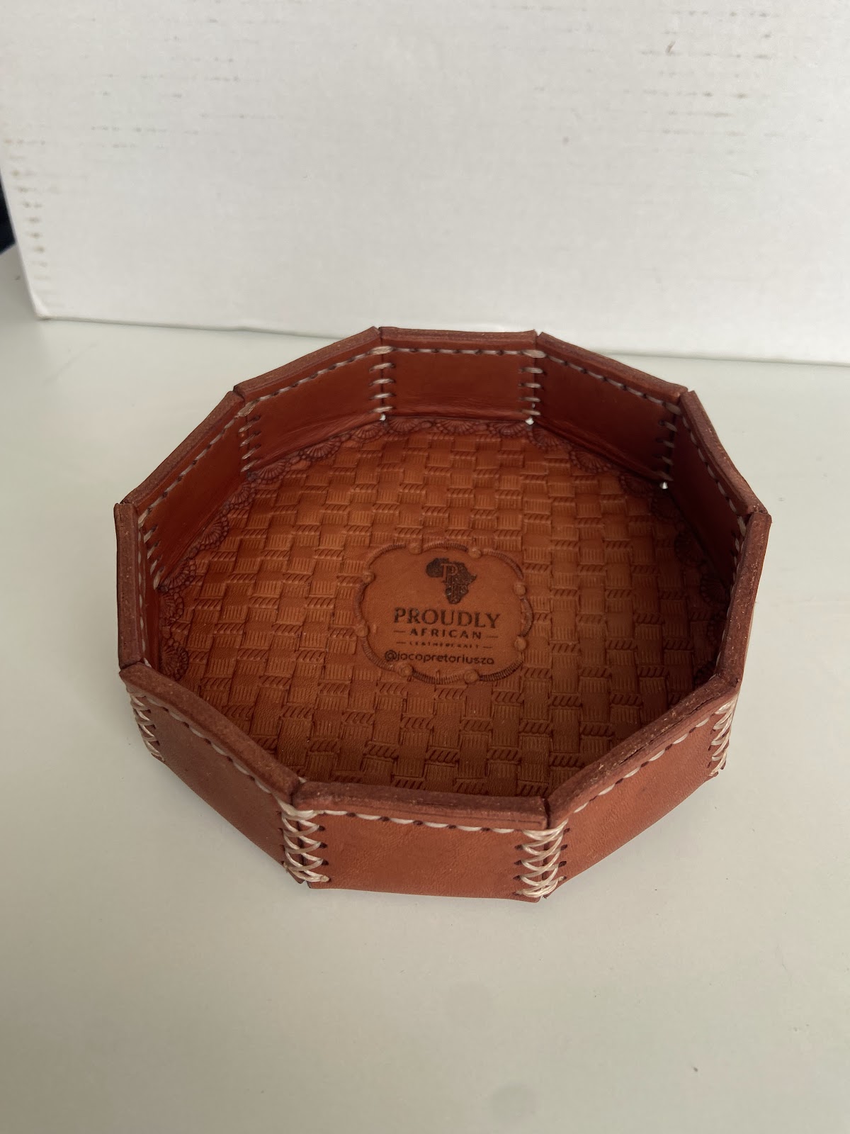 Octagonal leather tray with a stamped centre