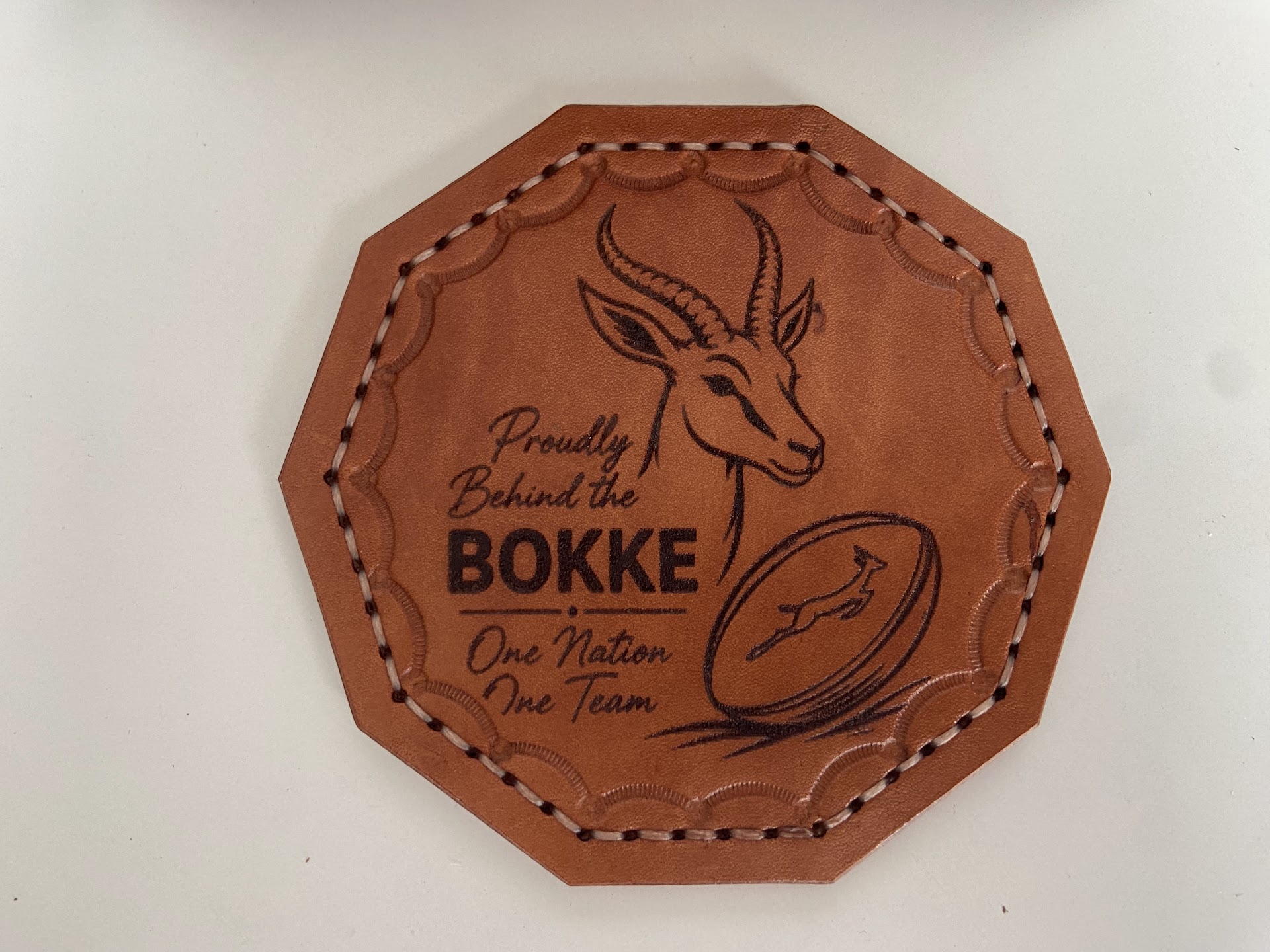 Personalised hand-stitched Springbok leather coaster