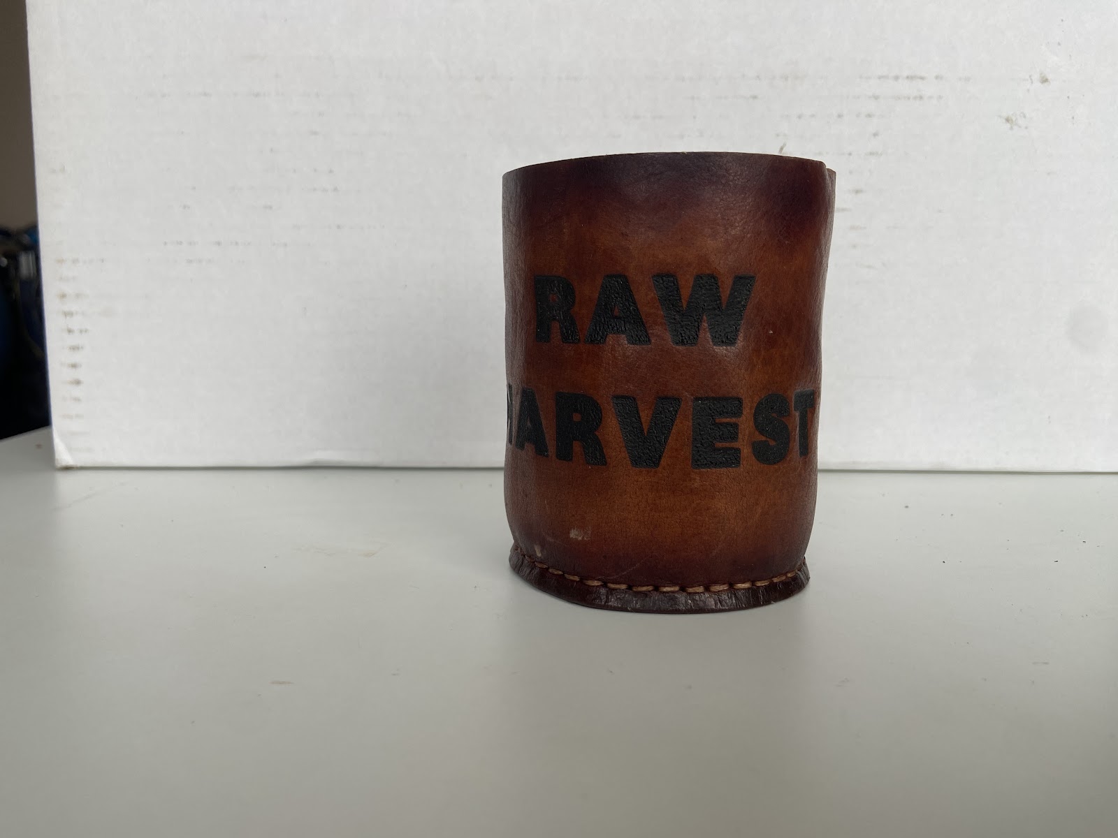 Leather drink sleeve with personalised lettering