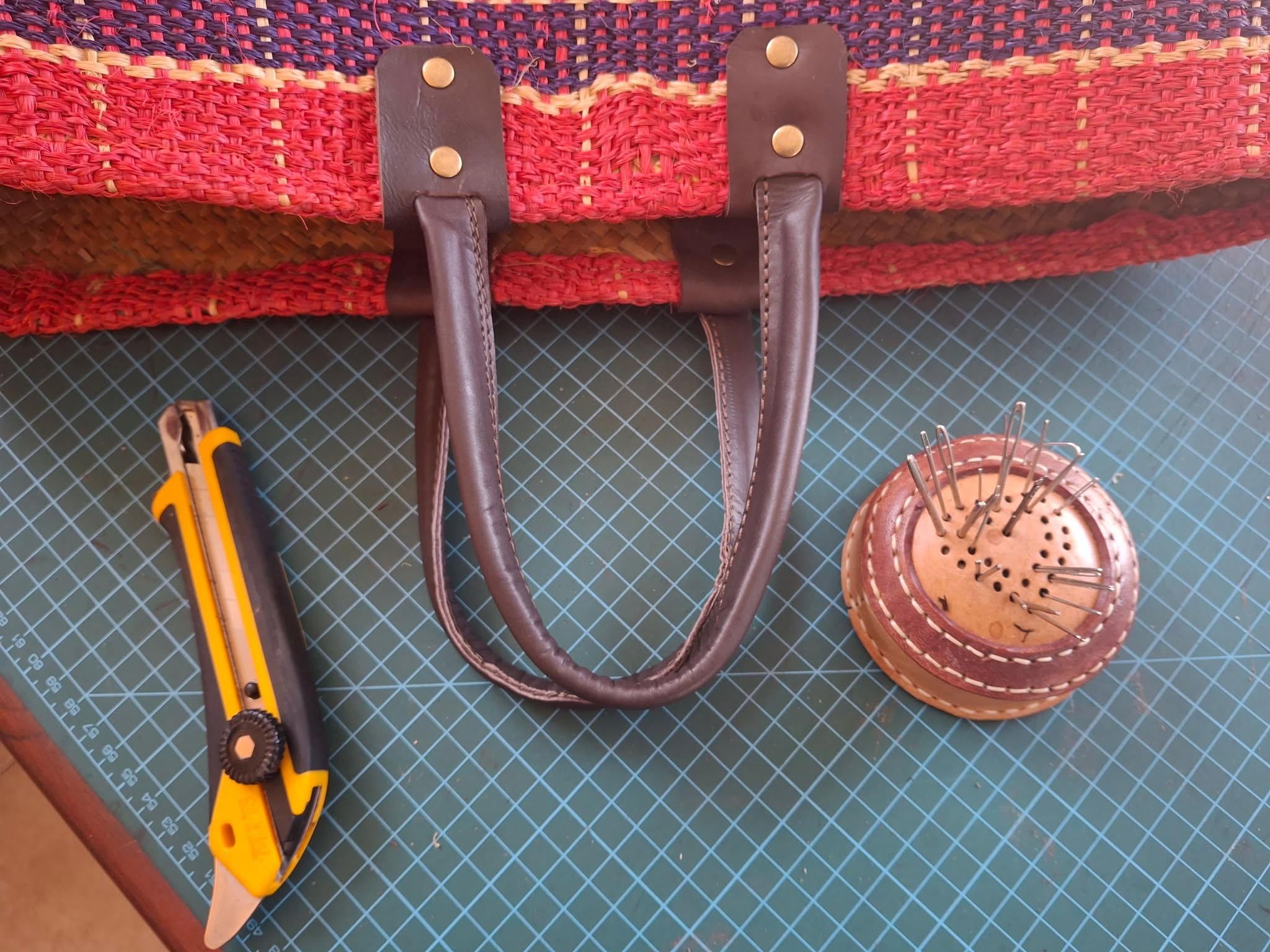 Colourful woven bag with leather handles